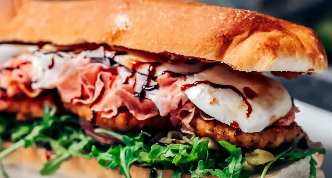 Ragz to Riches from the side: prosciutto, fresh mozzarella and a balsamic drizzle over a chicken cutlet and arugula